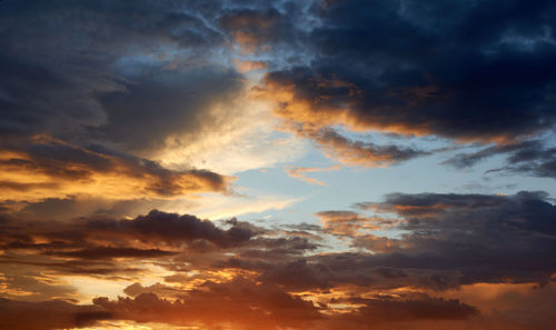 Low angle view of dramatic sky during sunset