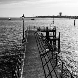 Pier over sea against sky