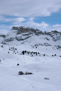 Scenic view of snow covered mountains against sky. winter hike around seceda, south tyrol, italy