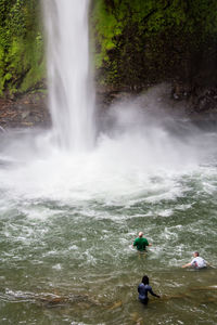 High angle view of people by waterfall