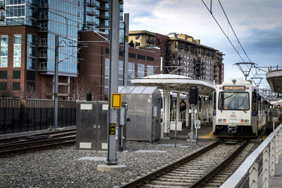 Train on railroad station platform against sky