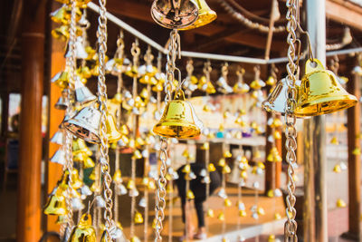Close-up of decorations hanging in store for sale