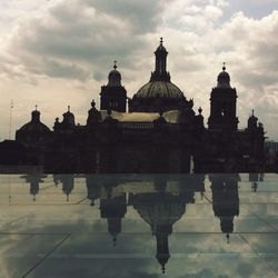 Building exterior against cloudy sky