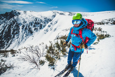 Full length of person on snowcapped mountains during winter