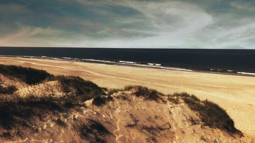 Scenic view of beach against sky