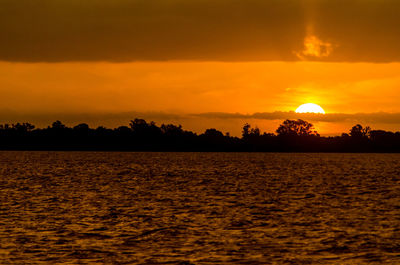 Scenic view of sea at sunset