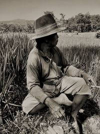 Man sitting on land