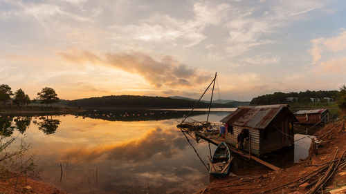 Scenic view of lake against sky during sunset