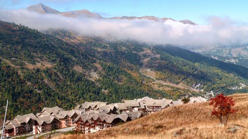 Scenic view of landscape and mountains against sky