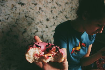 Woman showing pink donut