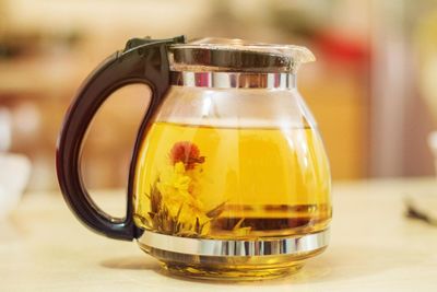 Close-up of tea in jar on table