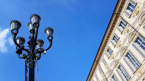 Low angle view of street light against building