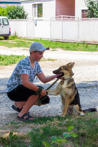 Full length of boy with dog