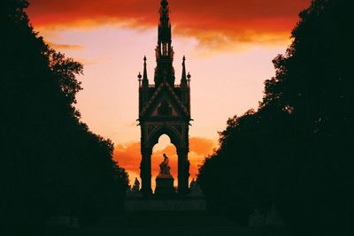 Low angle view of built structure at sunset