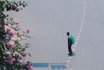 Full length of woman standing by railing