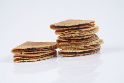 Stack of cookies against white background