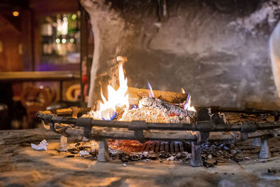 Burning fire place in rustic restaurant during winter