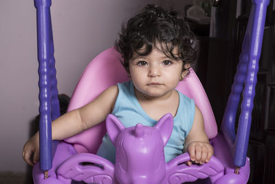 Portrait of cute baby girl at home