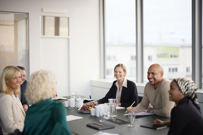 Smiling people at business meeting