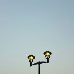 Low angle view of lamp against sky