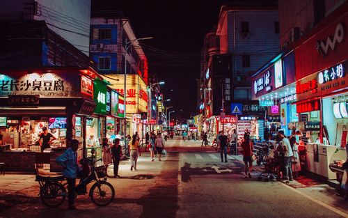 People on city street at night