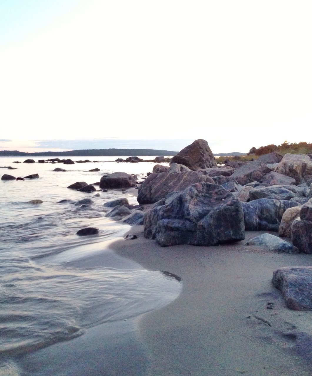 sea, water, tranquil scene, beach, clear sky, tranquility, scenics, rock - object, beauty in nature, horizon over water, rock formation, shore, nature, copy space, rock, idyllic, sand, coastline, cliff, remote