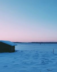 Scenic view of sea against clear sky during sunset