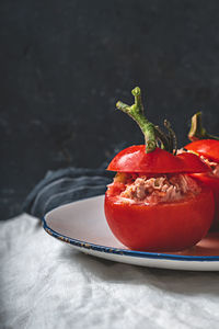 Close-up of red fruit in plate on table