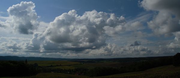 Scenic view of landscape against cloudy sky