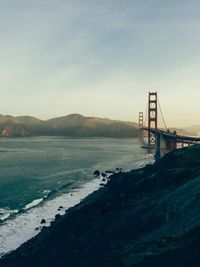 View of suspension bridge over sea