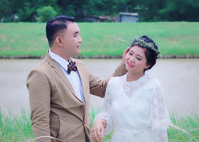 Young couple standing on field