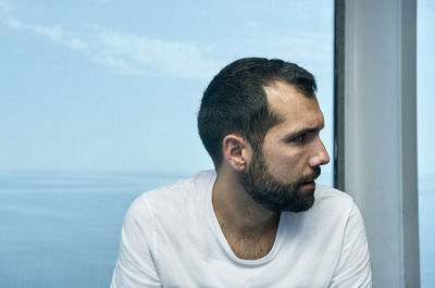 Portrait of young man looking away