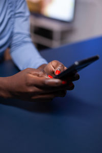 Close-up of man using mobile phone