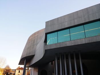 Low angle view of modern building against clear sky