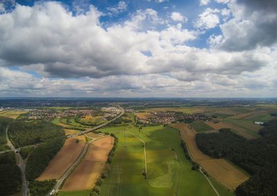 Aerial view of agricultural field against sky