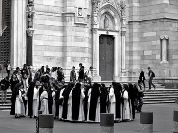 Group of people in front of historic building