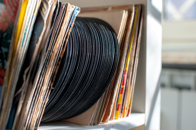 Close-up of vintage records on shelf