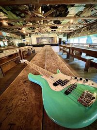 High angle view of guitar on table