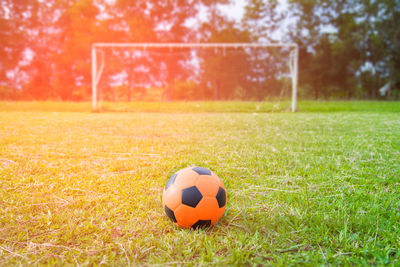 Close-up of soccer ball on field