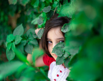 Portrait of girl with green leaves