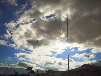 Low angle view of building against cloudy sky