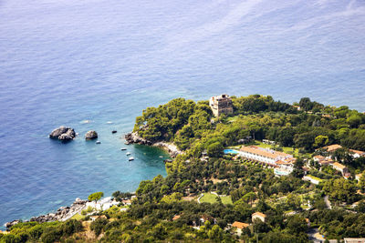 High angle view of buildings by sea