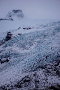 Scenic view of sea against sky during winter