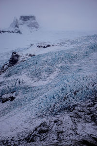 Scenic view of sea against sky during winter