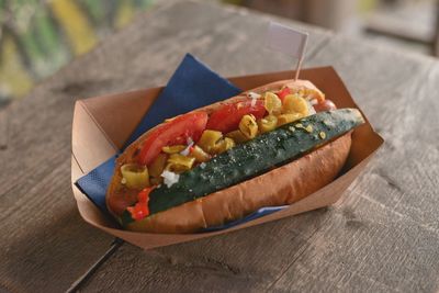 High angle view of hot dog in paper box on table