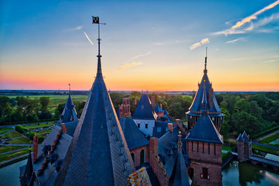 High angle view of de haar castle against sky at sunset