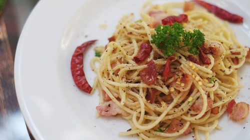 Close-up of noodles served in plate on table