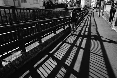 Shadow of man on bridge