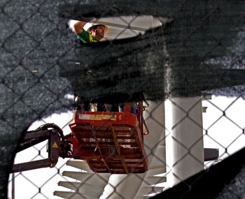 Close-up of man with shadow of building