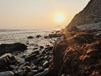 Scenic view of sea against sky during sunset